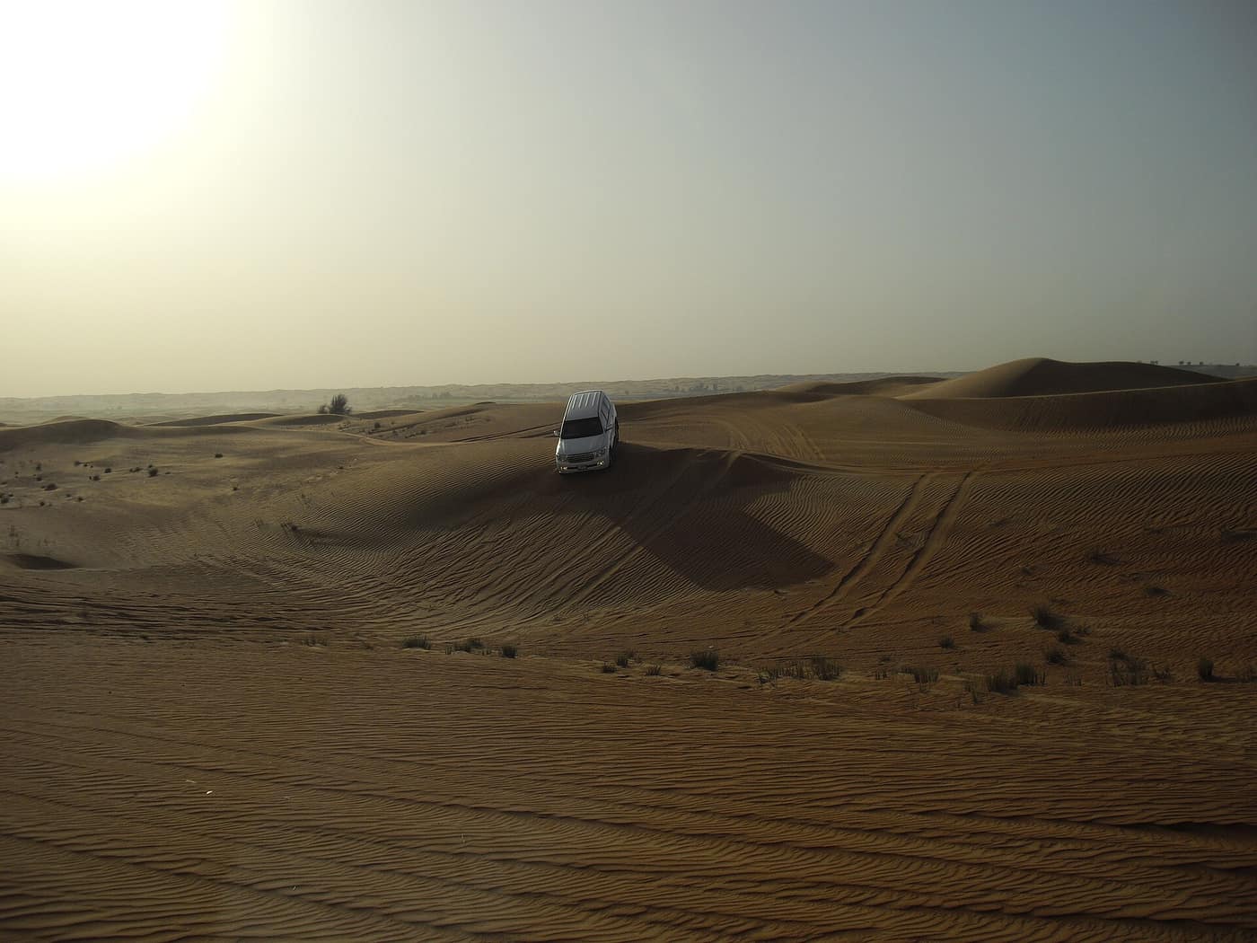 A four-wheel-drive on the sand dunes outside Dubai