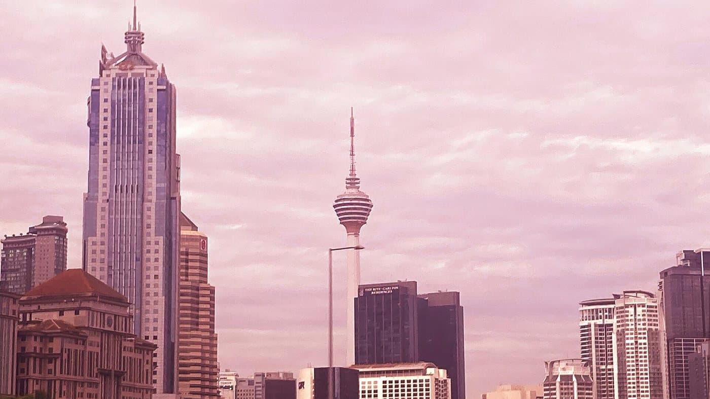 Kuala Lumpur Tower seen between the towers along the Ampang Elevated Highway